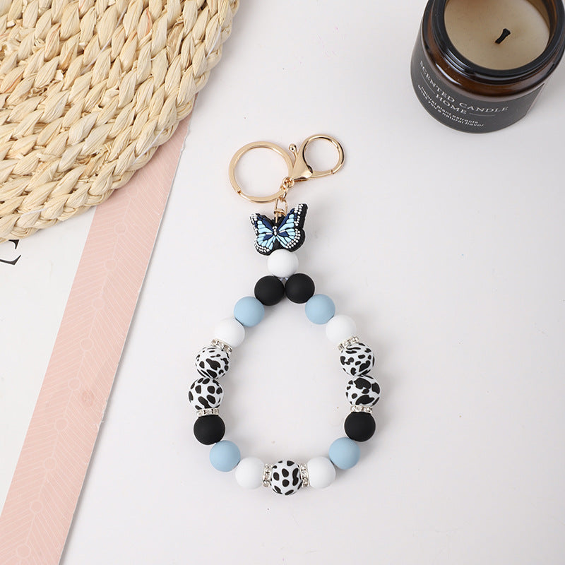 Wholesale Rubber Tassel Silicone Wood Water Keychain